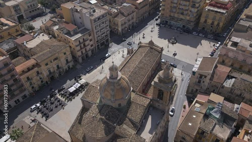 descending behind church dome in Gela Sicily