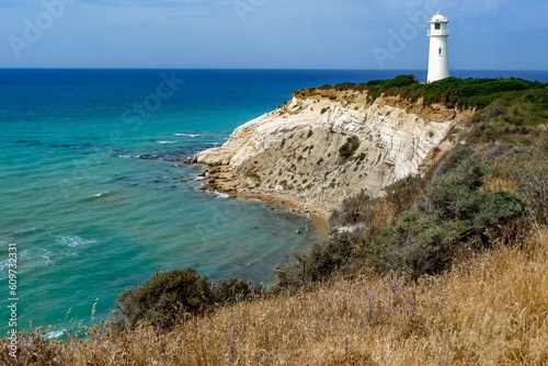 lighthouse on the coast in the sun