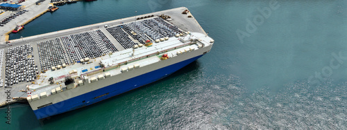 Fotografie Aerial drone ultra wide photo with copy space of large car carrier ro ro vessel