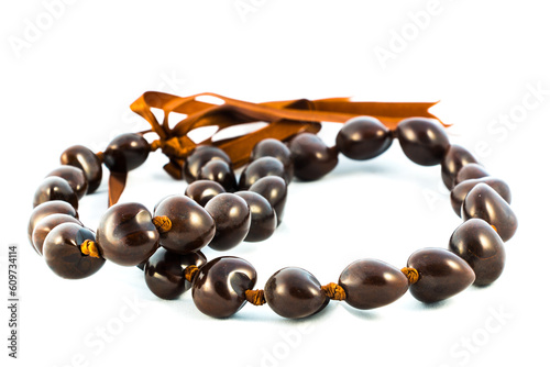 An authentic kukui nut lei from Hawaii isolated on white.