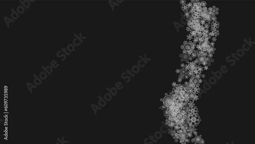 Silver snowflakes frame on black background. Horizontal shiny Christmas and New Year frame for gift certificate, ads, banners, flyers. Falling snow with glitter silver snowflakes for party invite