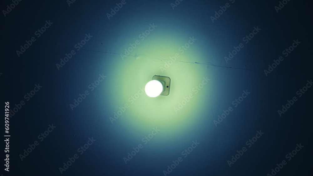 a light glows with a unique bluish-green color around it a light glows with a unique bluish-green color around it