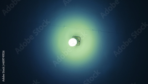 a light glows with a unique bluish-green color around it