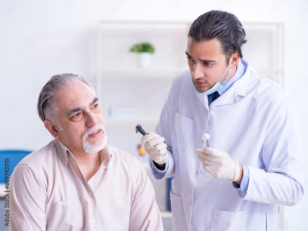 Male patient visiting doctor otolaryngologist