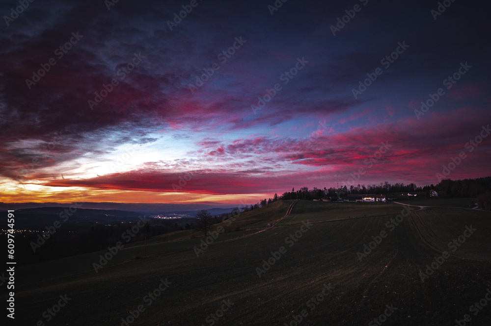 Dramatic sunset skies over Swiss hills