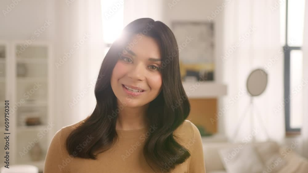 Young beautiful smiling woman speaking on video call. Vlogger using smartphone talking at camera webcam online. Blogger online streaming, communicating with friend, selfie call, lifestyle vlog concept