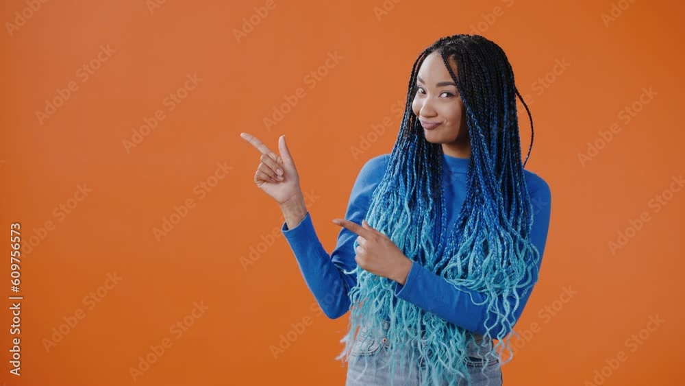 Young woman points finger to ad with profitable offer