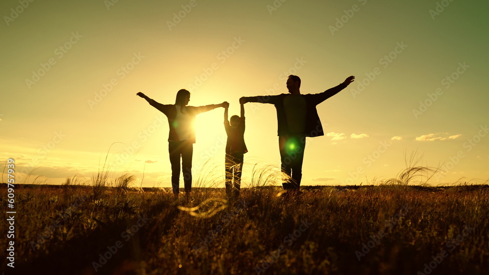 Family walk in meadow. Happy family with child, girl are walking in
