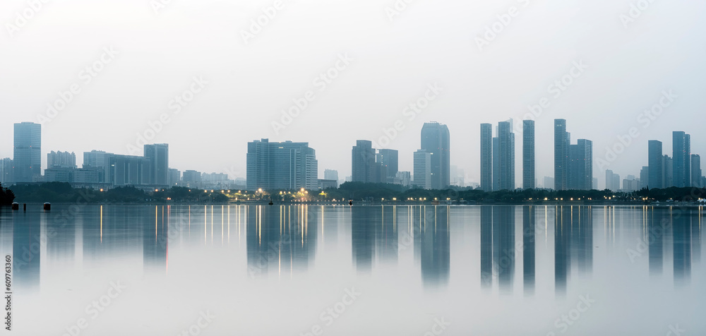 Reflection of modern city buildings in water at morning Reflection of modern city buildings in water at morning