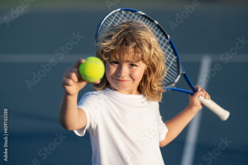 Tennis child player on tennis court. Sport concept.