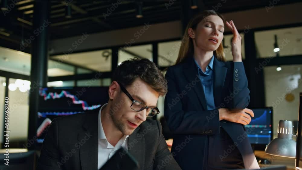 Disappointed business team failure in dark office. Frustrated man manager talk Disappointed business team failure in dark office. Frustrated man manager talk