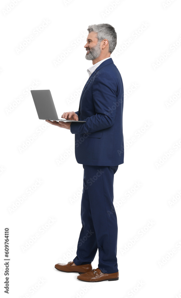 Mature businessman in stylish clothes with laptop on white background