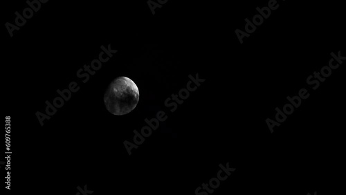 Moon transitions behind clouds--NIGHT 01