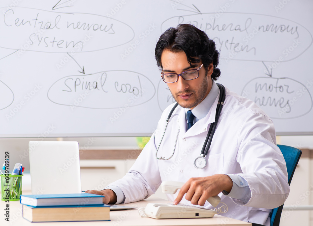 Young male doctor neurologist in front of whiteboard Young male doctor neurologist in front of whiteboard