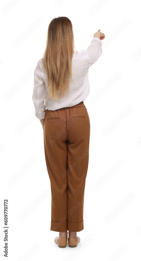 Businesswoman pointing at something on white background, back view