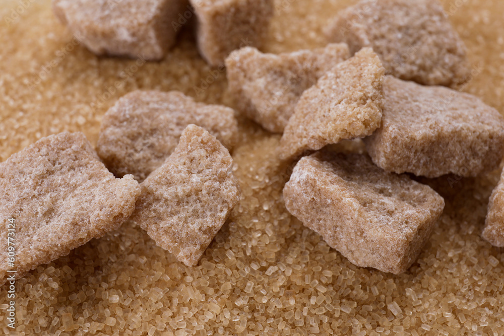Refined and granulated brown sugar as background, closeup Refined and granulated brown sugar as background, closeup