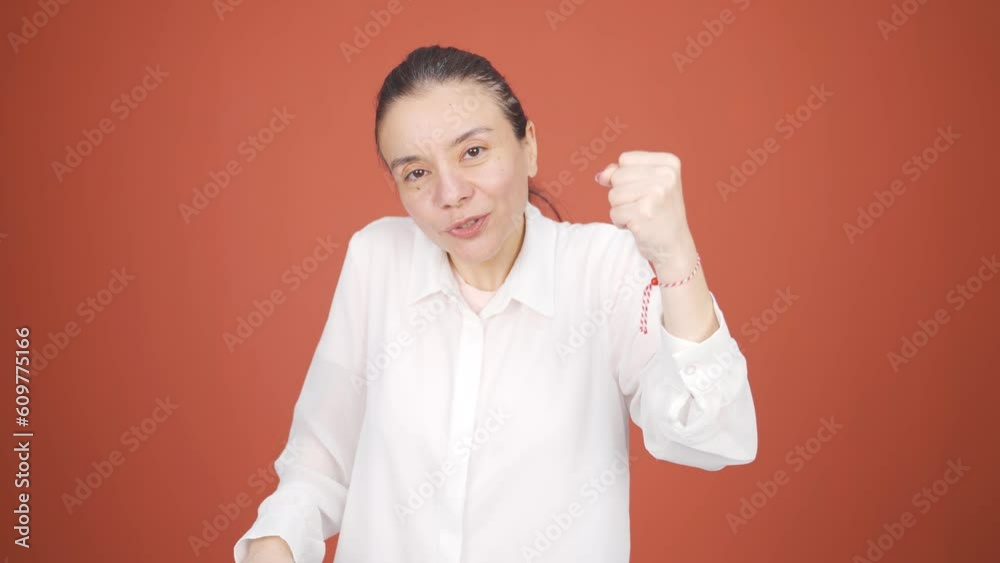 Woman giving motivational speech to camera. Woman giving motivational speech to camera.