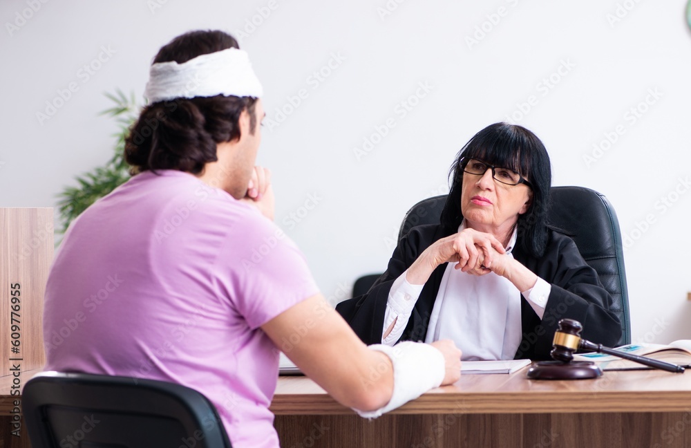 Disabled man consulting judge for damages litigation