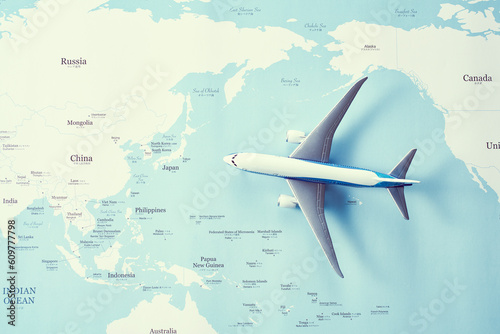 世界地図の上のミニチュア飛行機 photo