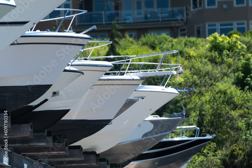 Row of boats on shelves  at boat storage near Edmond marina -3