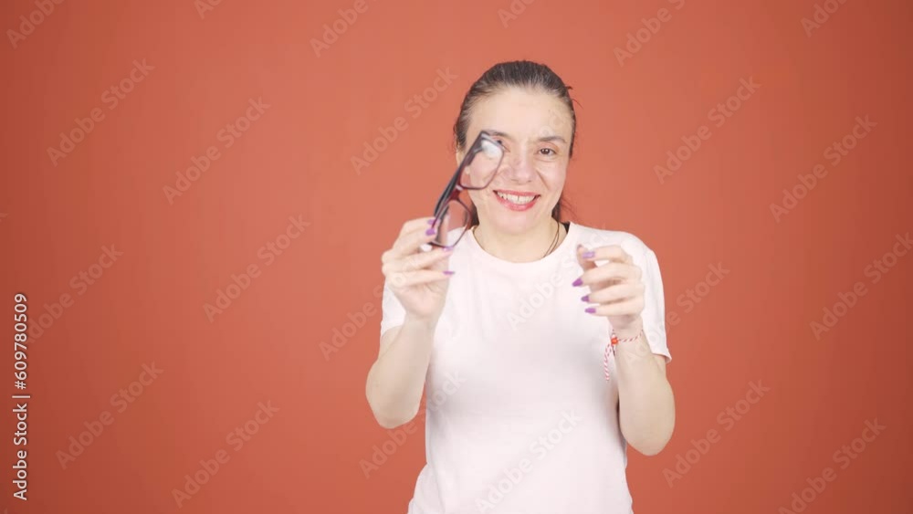 Woman with no vision problems throws glasses in trash. Woman with no vision problems throws glasses in trash.