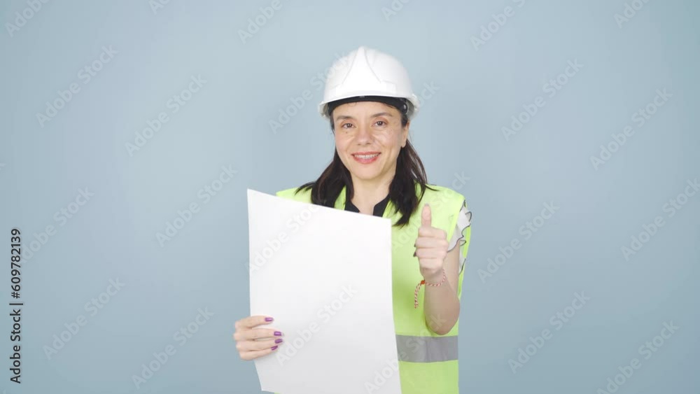 Engineer looking at camera and making positive gesture. Engineer looking at camera and making positive gesture.