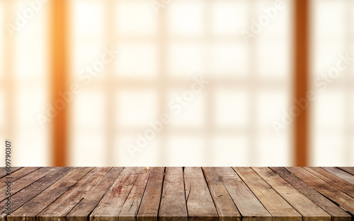 Wooden board empty table background. defocussed sunny room interior