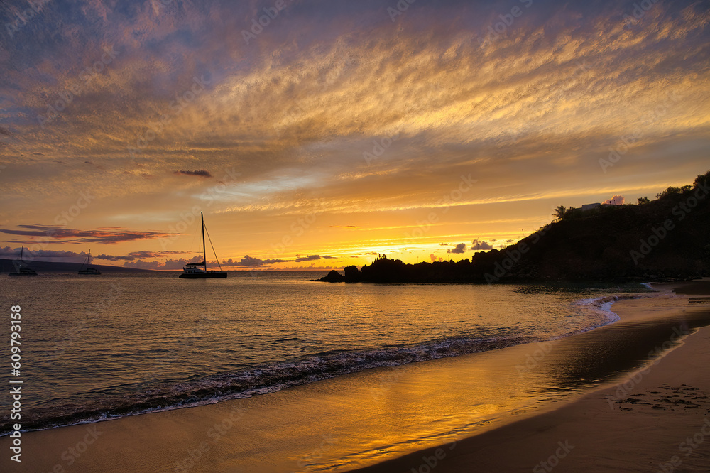 Beautiful golden sunset at Black Rock on Ka'anapali Beach on Maui.