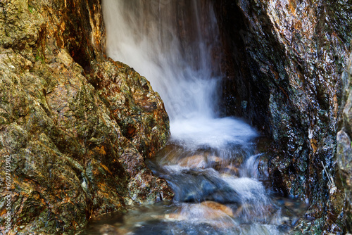 Long Exposure Small Waterfall And Creek With Rocks