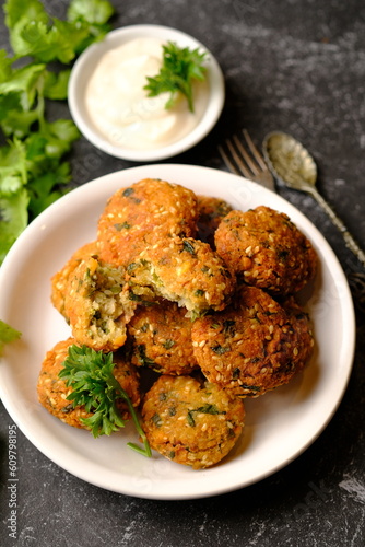 Falafel is a deep-fried ball or patty made from ground chickpeas, fava beans, or both. Falafel is a traditional Middle Eastern food, commonly served in a pita, which acts as a pocket, or wrapped. 