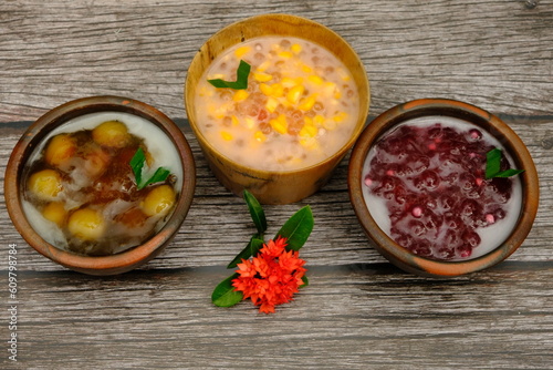 Assorted of Indonesian traditional porridge, such as  bubur jagung Mutiara (corn sago), bubur mutiara (sago) bubur biji salak (sweet potatoe). Indonesian food. 
