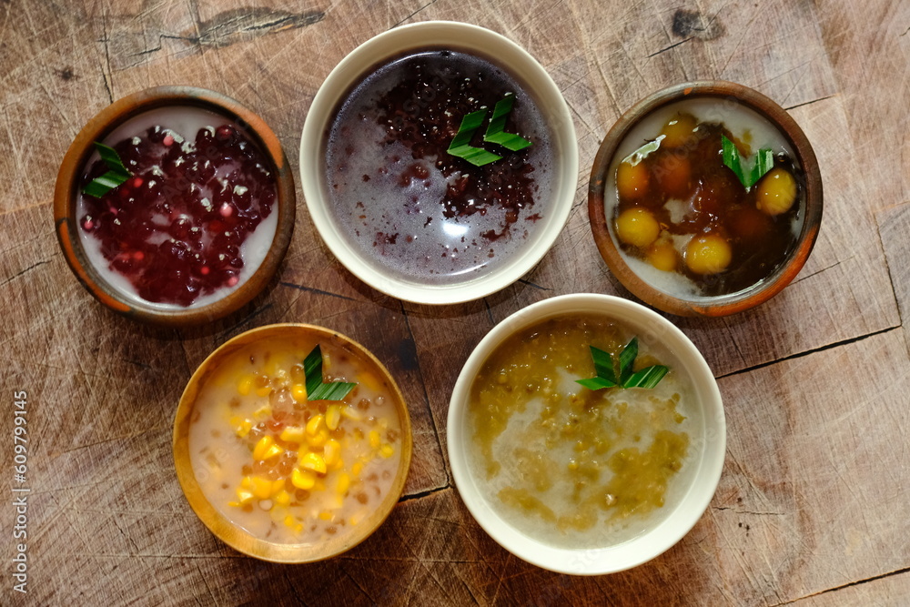 Assorted of Indonesian traditional porridge, such as bubur kacang ijo (mung bean), bubur jagung Mutiara (corn), bubur ketan hitam (black rice), bubur biji salak (sweet potatoe). This meal is popular. Assorted of Indonesian traditional porridge, such as bubur kacang ijo (mung bean), bubur jagung Mutiara (corn), bubur ketan hitam (black rice), bubur biji salak (sweet potatoe). This meal is popular.