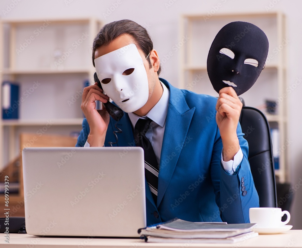 Young male employee wearing masks in the office