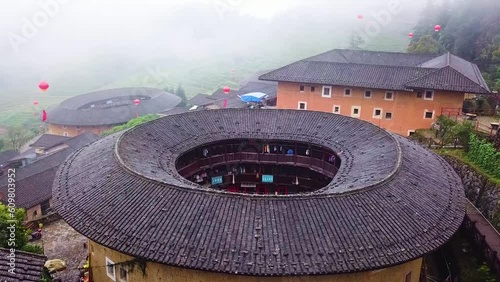Aerial Pull-In Shot of a Unesco World Heritage Tulou in Fujian Province, China photo