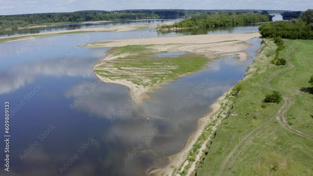 Aerial view of the Vistula River, dry riverbed, sunny day, person walking Aerial view of the Vistula River, dry riverbed, sunny day, person walking