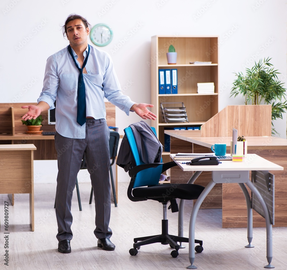 Young male employee being late for his job Young male employee being late for his job