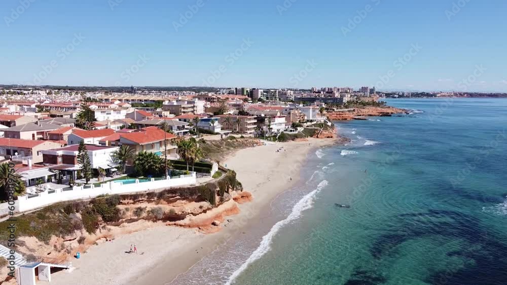 Aerial drone view of cityscape and coastline of Mil Palmeras beach and Pilar de la Horadada in Spain. Aerial drone view of cityscape and coastline of Mil Palmeras beach and Pilar de la Horadada in Spain.
