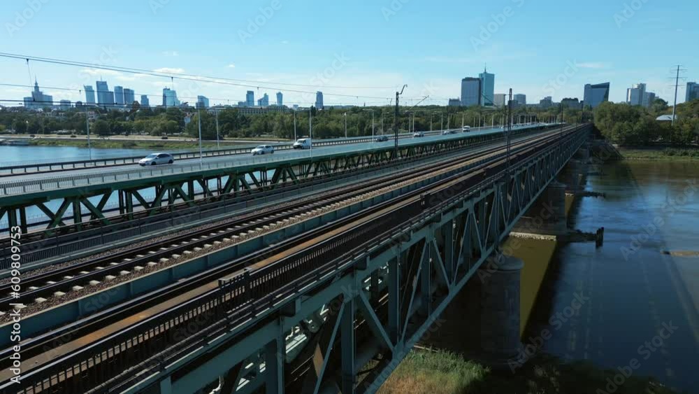 Aerial view of Warsaw, Poland, with city skyline revealed from behind two bridges on a scorching hot and sunny day Aerial view of Warsaw, Poland, with city skyline revealed from behind two bridges on a scorching hot and sunny day