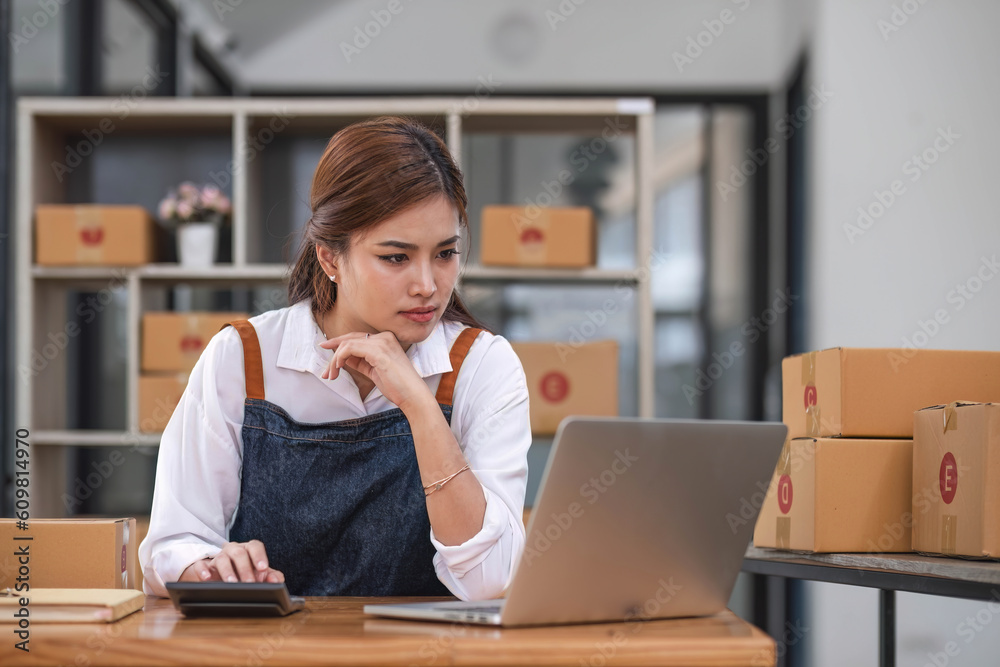 Small Business, Startup SME, Owner Entrepreneurs. Asian woman with unsuccess business online shopping crying and serious face unhappy mood. Small Business, Startup SME, Owner Entrepreneurs. Asian woman with unsuccess business online shopping crying and serious face unhappy mood.