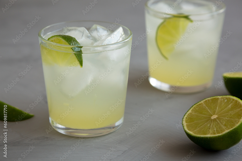 Homemade Cold Refreshing Iced Limeade in a Glass, side view. Copy space.