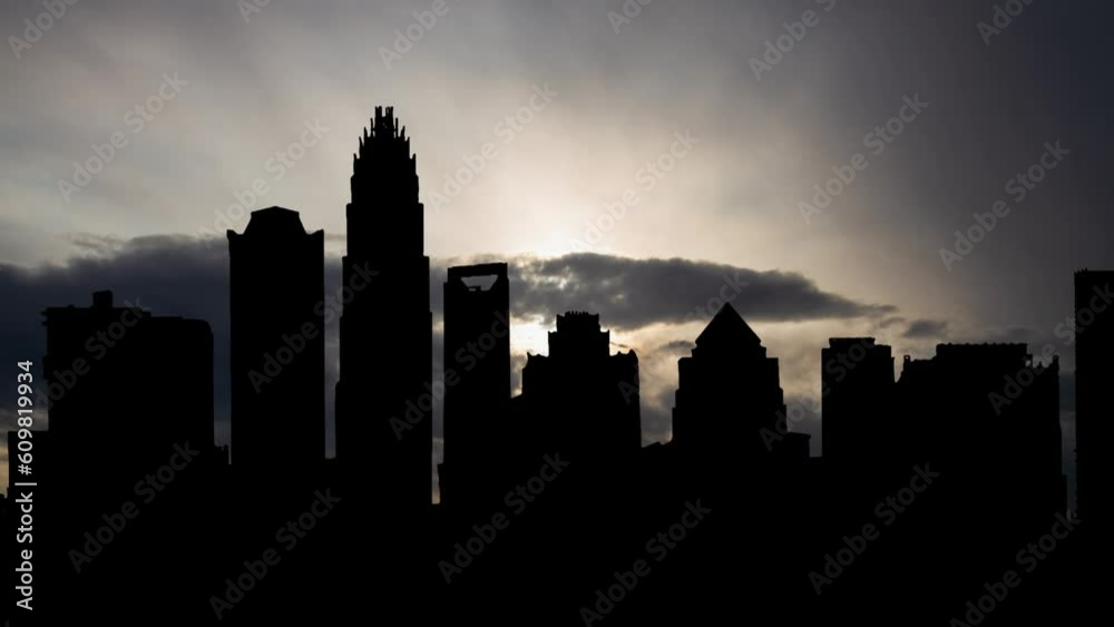 Downtown Charlotte, Time Lapse at Sunrise with Fast Clouds and Dark Silhouette of Skyscrapers, North Carolina Downtown Charlotte, Time Lapse at Sunrise with Fast Clouds and Dark Silhouette of Skyscrapers, North Carolina