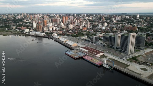 Aerial Drone Fly Above Asuncion, Paraguay Capital Riverside Cityscape in Warm Daylight, Establishing Shot, Port and Urban Area photo