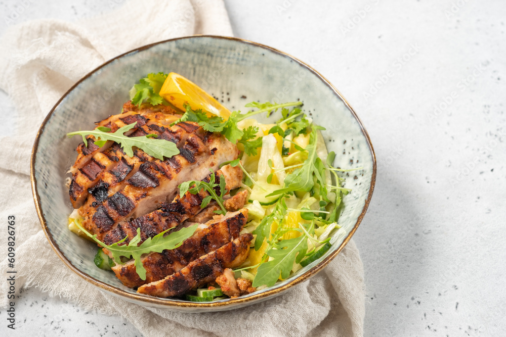 salad with grilled chicken, orange, cucumber and arugula salad with grilled chicken, orange, cucumber and arugula
