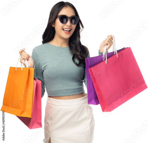 Portrait excited beautiful woman wearing sunglasses hold shopping bags isolated on white background and copy space Surprise happy asian lady open mouth with excited Beauty young female love shopping
