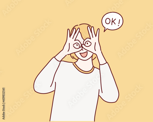 woman is showing a gesture Okay, ok. Hand drawn style vector design illustrations.