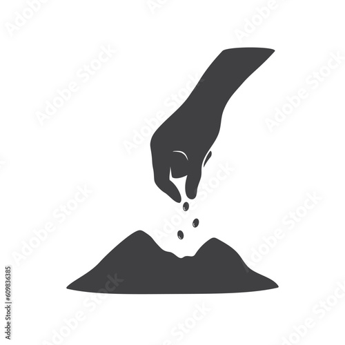 A hand is putting seeds on the ground isolated vector illustration.