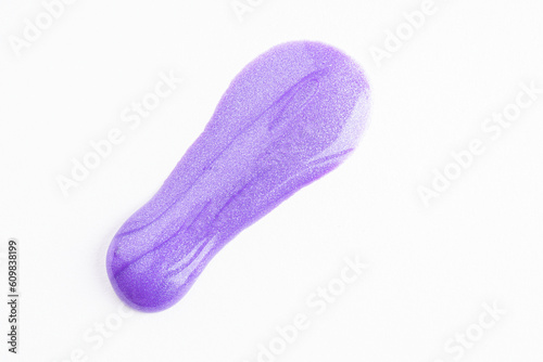 Lilac cosmetic cream smear on white background. Violet beauty cream smear swipe swatch closeup. Lavender face serum, lotion, moisturizer on white. Light purple paint swatch