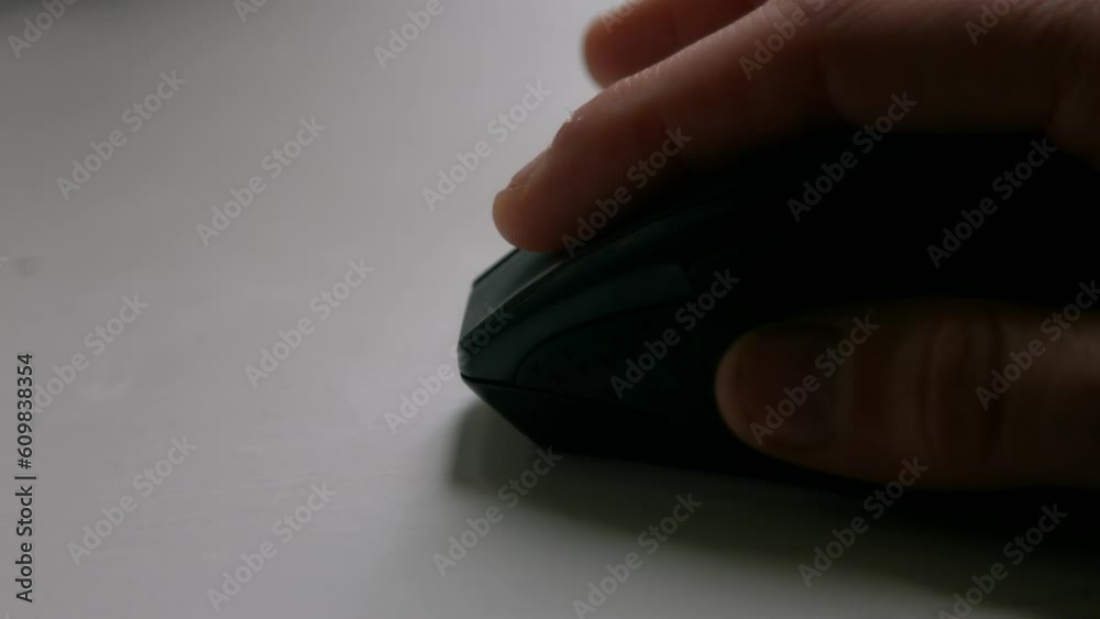 Hand on Computer Mouse Clicking and Scrolling Doing Office Work on White Desk Hand on Computer Mouse Clicking and Scrolling Doing Office Work on White Desk