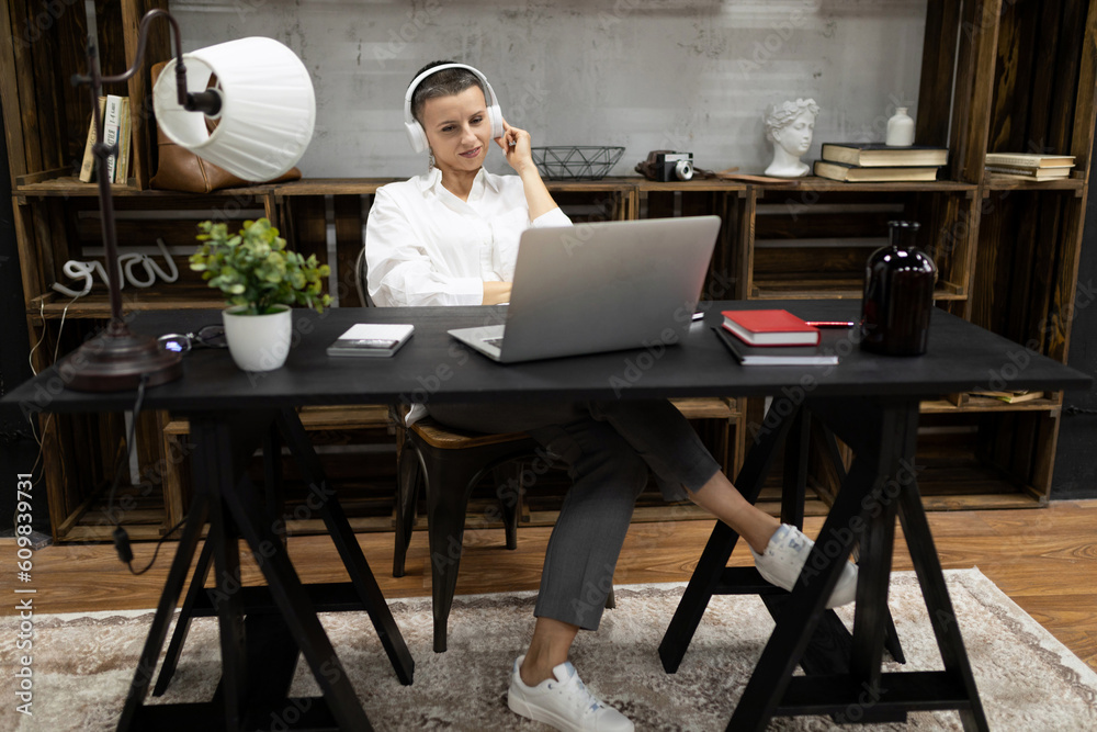 businesswoman broker working on a deal while sitting in the office businesswoman broker working on a deal while sitting in the office