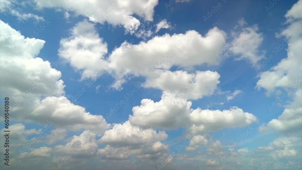 Timelapse of Cumulus white clouds floating on blue sky in beautiful morning